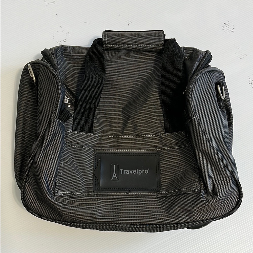 Travelpro Carry on bag NWOT , gray color.